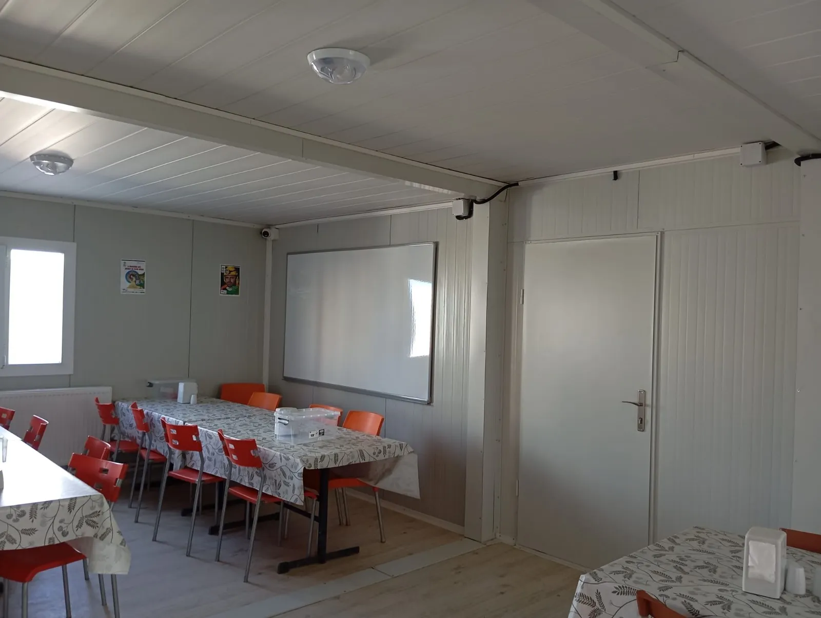 Prefabricated dining hall with kitchen and seating area