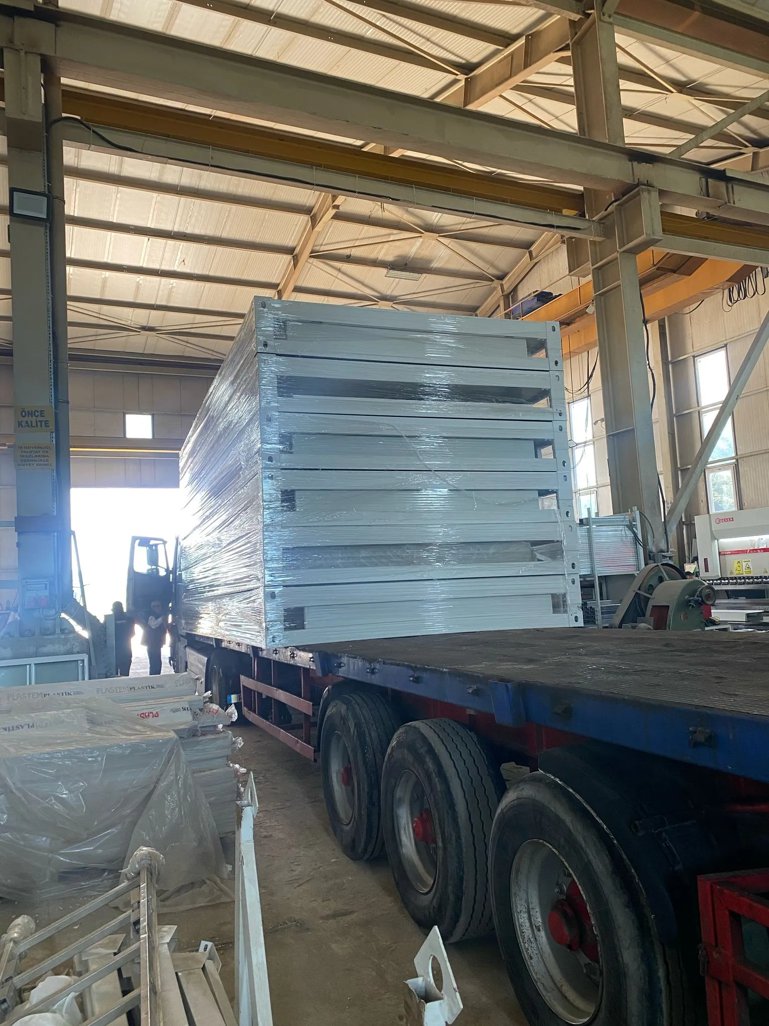 Modern warehouse for flat pack house assembly services and container fabrication.